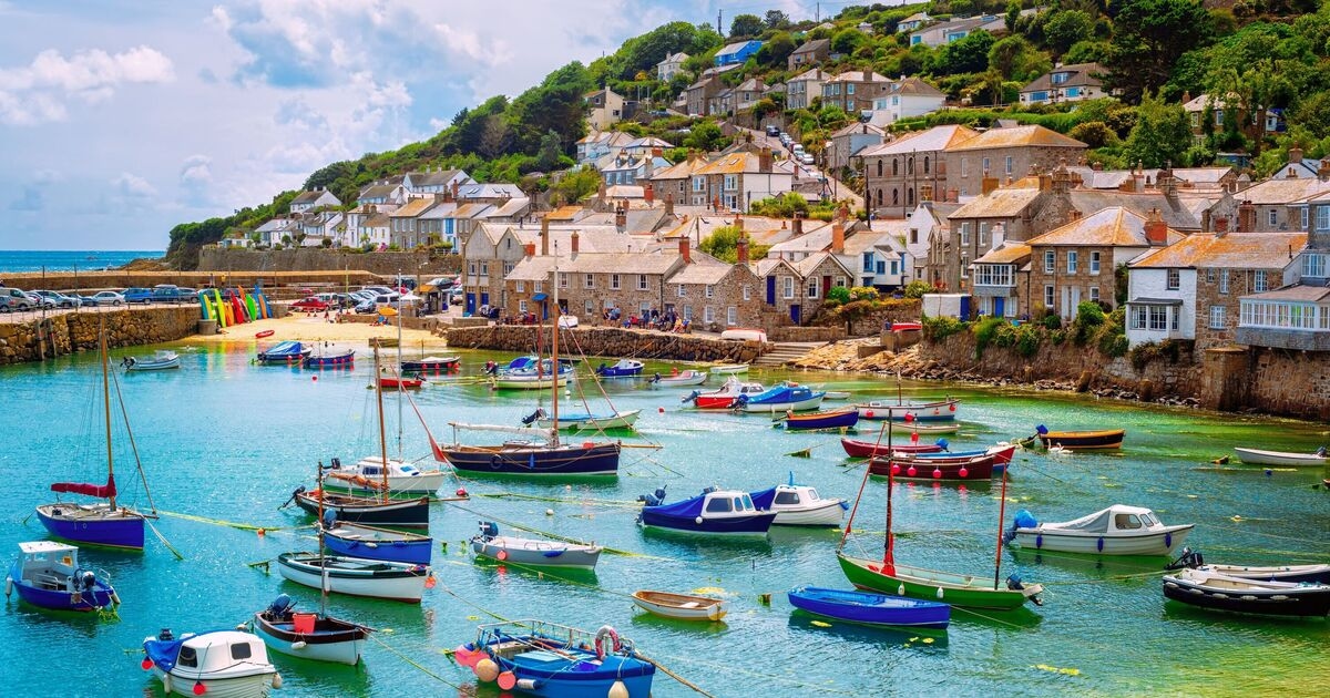 'Loveliest village in England' with white cottages, golden sands and cobbled streets