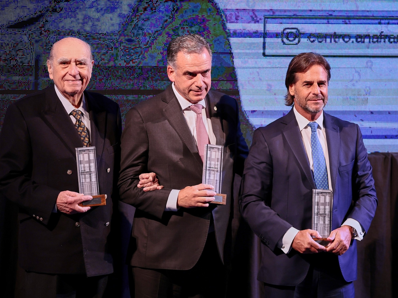 The president of Uruguay and two of his predecessors at an event condemning those who attack freedom of expression.
