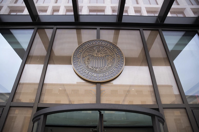 Fed holds interest rates again after Trump insults